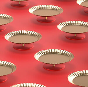 Creative shot of golden plates on a red background.